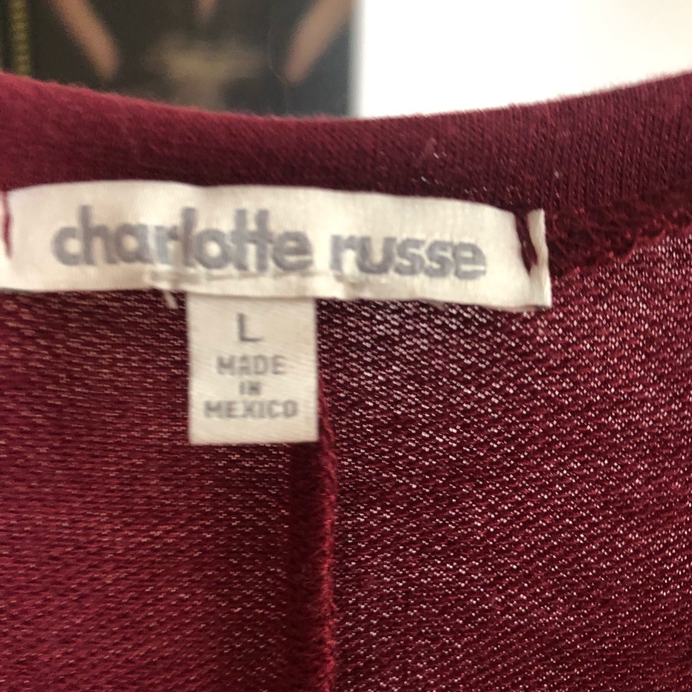 Burgundy tunic with floral detail